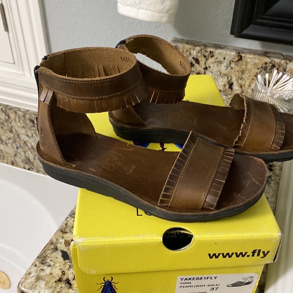 Leather sandals by Fly London. Only worn a couple of times. Like new condition.